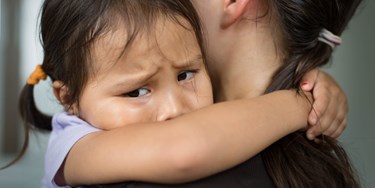 Anxious Child Holding Her Mother Comfort