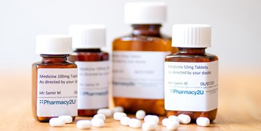 Close up of bottles of pills with Pharmacy2U logo on