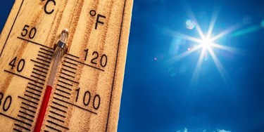 Close up of thermometer outside in scorching heat