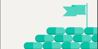 Illustration - mountain made of pills with flag on top