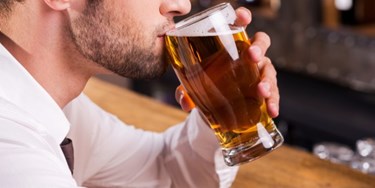 Man drinking a pint