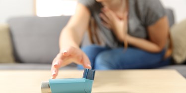 Woman Reaching For Inhaler