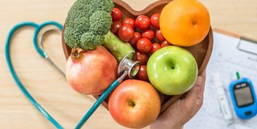 Healthy food in heart shaped bowl