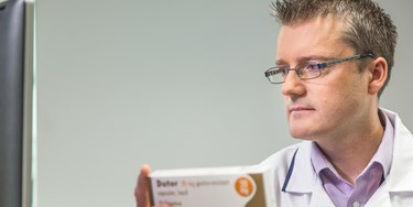 Superintendent Pharmacist Phil Day checking a prescription