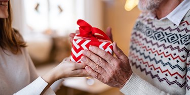Couple exchanging a Christmas gift