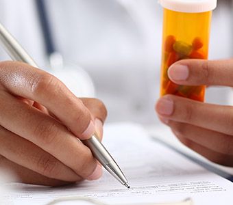 Close up of prescription being filled out